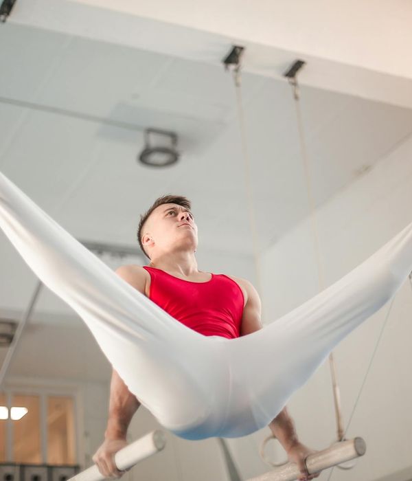 Man performing a strength training exercise with focused determination.